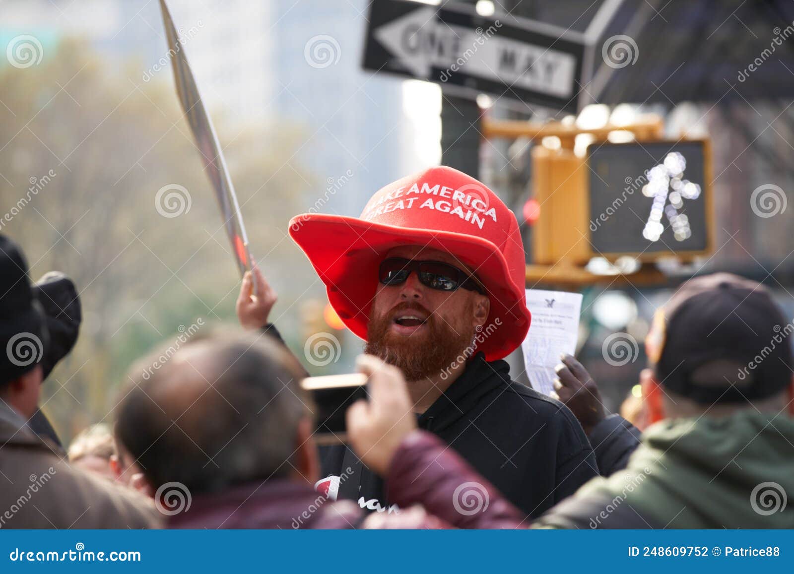 men-wearing-large-make-america-great-again-hat-nyc-veterans-day-parade-oversize-maga-red-color-standing-out-manhattan-248609752.jpg