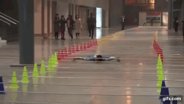 8-year-old-boy-from-india-sets-new-distance-record-for-limbo-skating-under-bars.gif