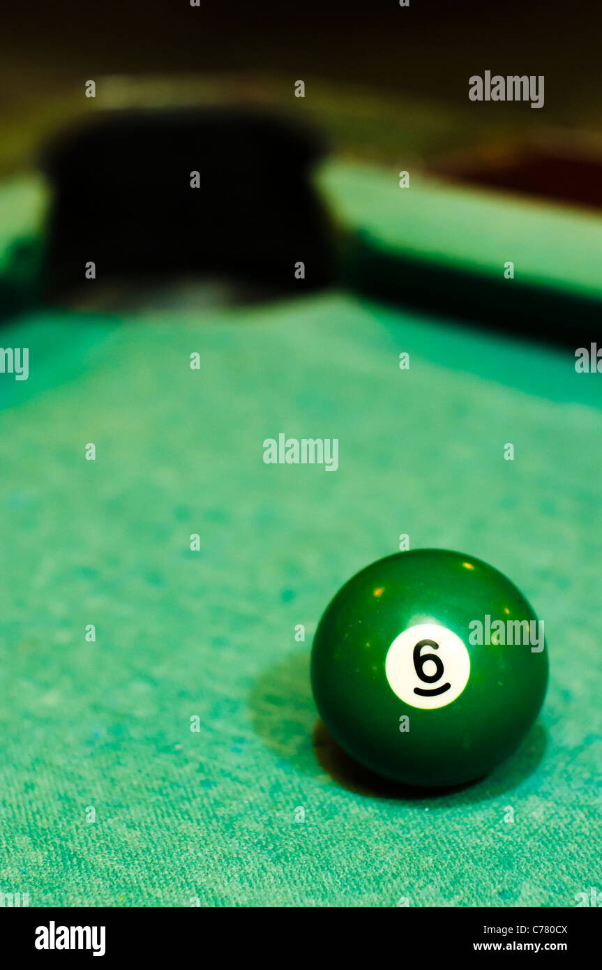 a-close-up-of-billiard-ball-number-6-solid-green-for-conceptual-usage-C780CX.jpg